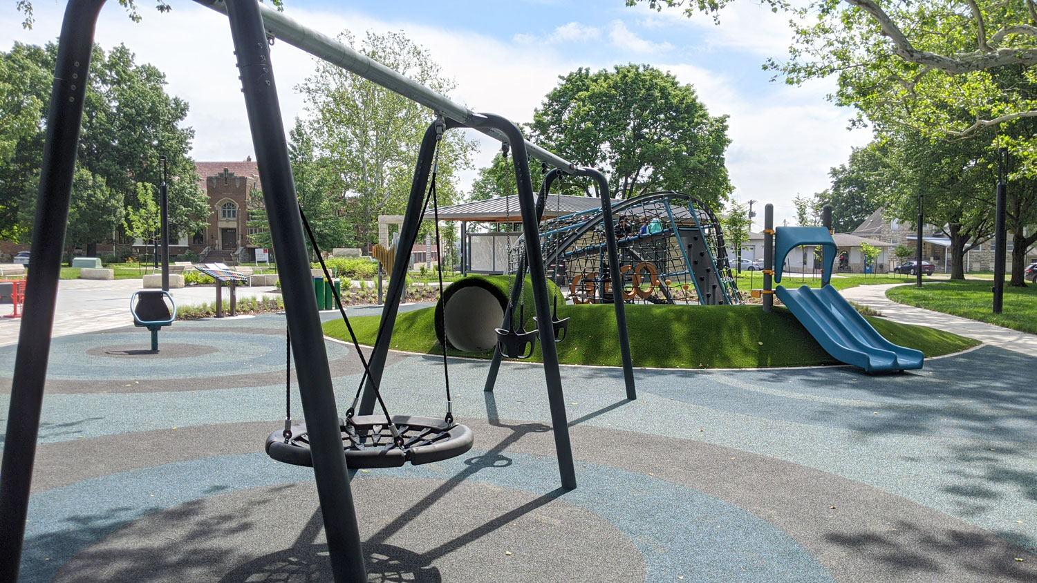 This is an image of downtown overland park thompson park playground swings web