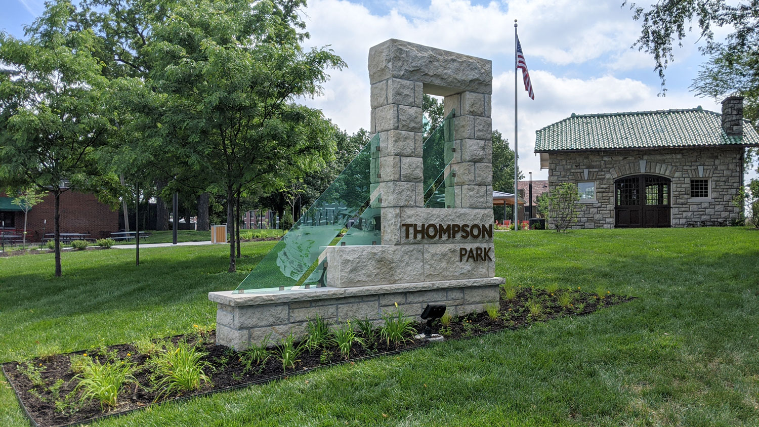 This is an image of downtown overland park thompson park west entrance strang carriage house sign web