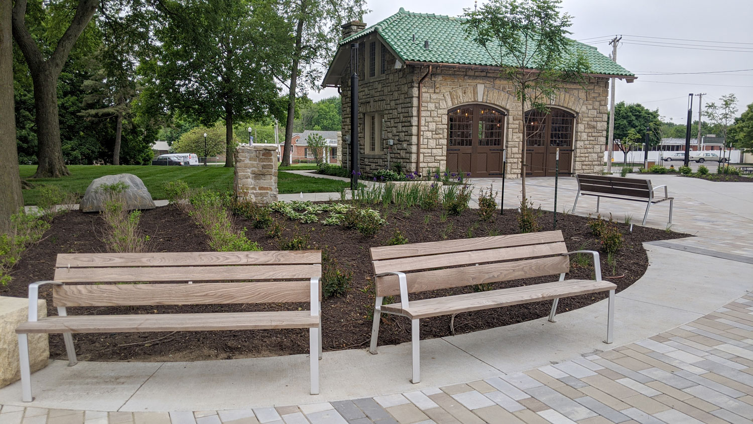 This is an image of downtown overland park thompson park bench carriage house web